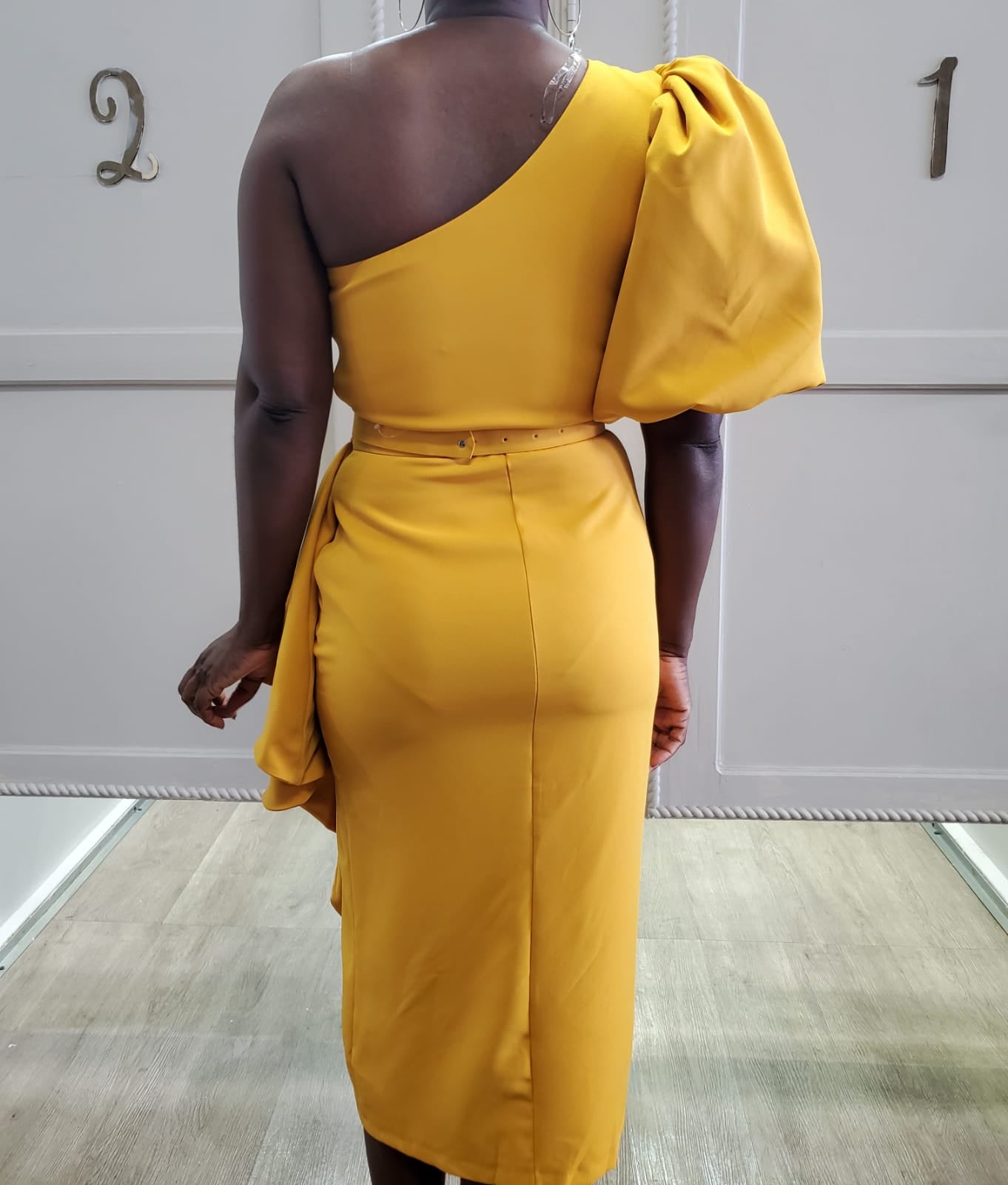 Dramatic Peplum Elegance with Jeweled Belt