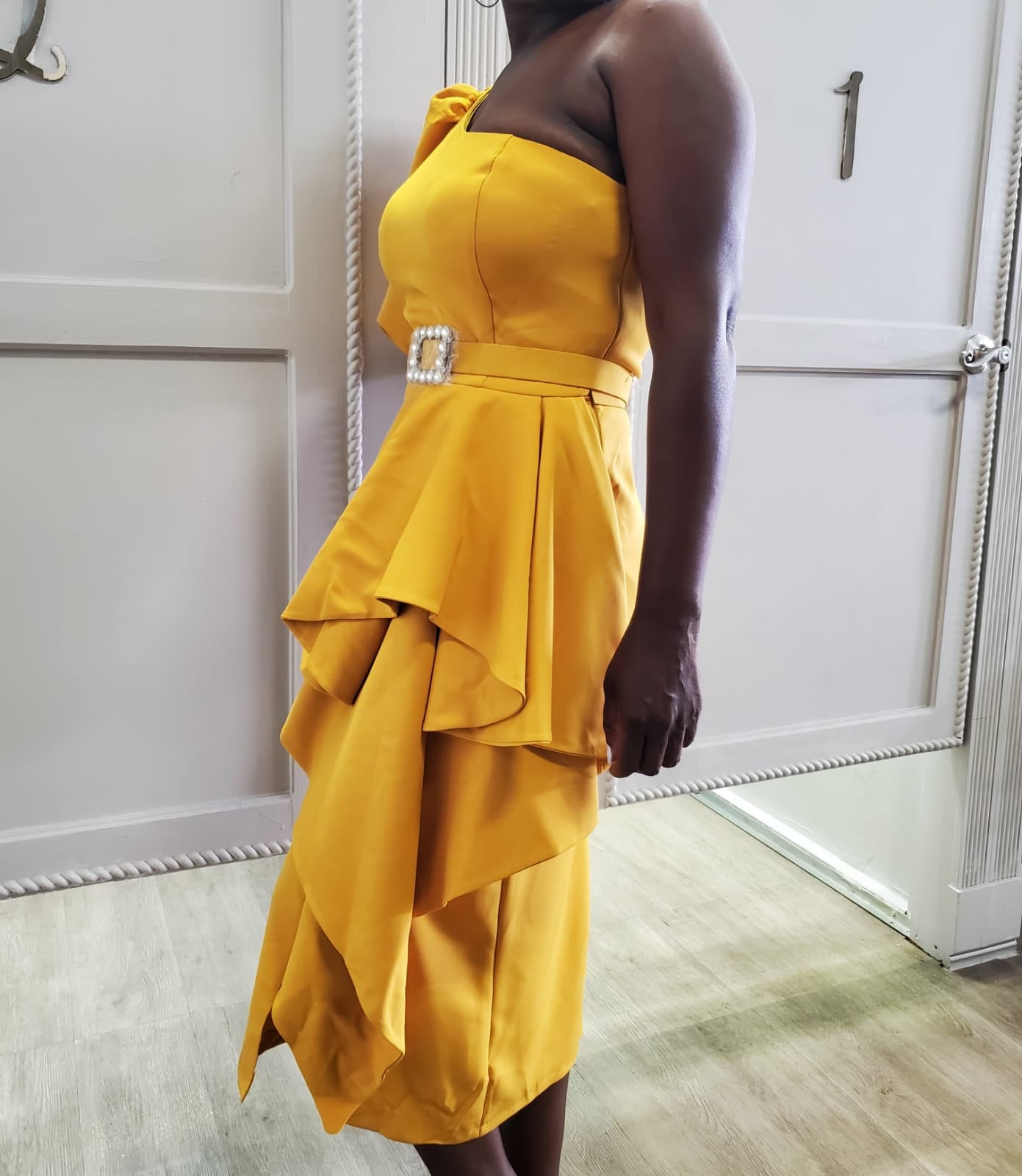 Dramatic Peplum Elegance with Jeweled Belt