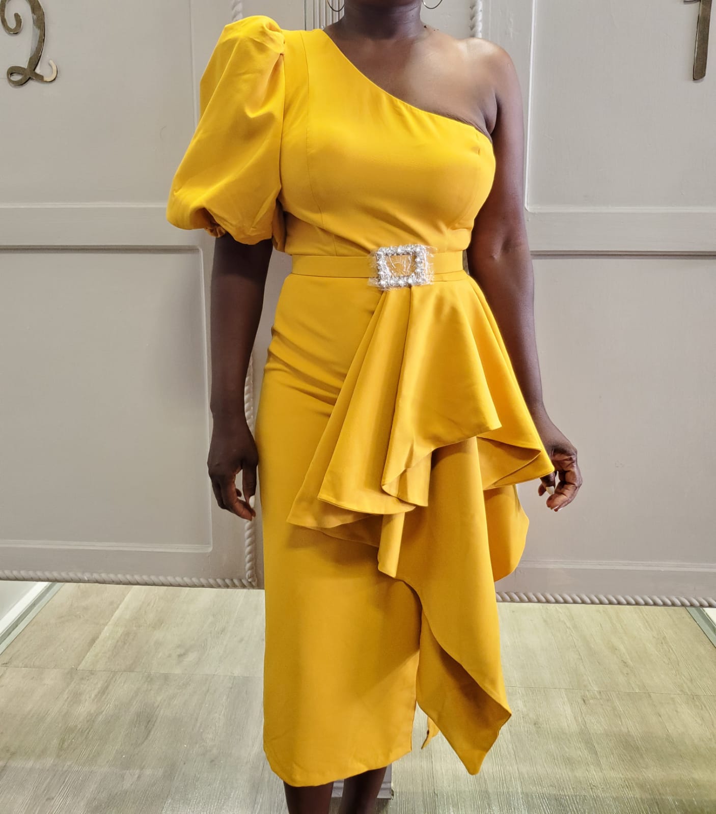 Dramatic Peplum Elegance with Jeweled Belt